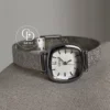 A delicate blend of modern elegance and vintage charm, this silver sparkle oval women's watch is designed to make a subtle yet striking statement. Featuring a polished oval case and a minimalist white dial, the design is elevated by a shimmering textured strap that catches the light beautifully with every movement.