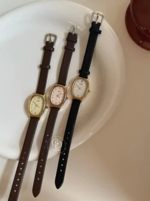 GEDI Chic Gold Oval Face Leather Strap Watch for Women